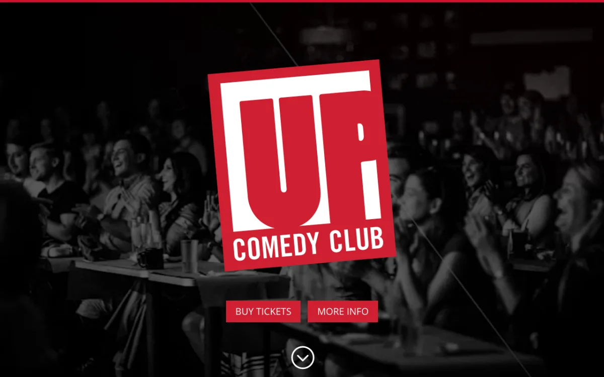 Homepage of the UP Comedy Club site, with the UP logo over a laughing audience